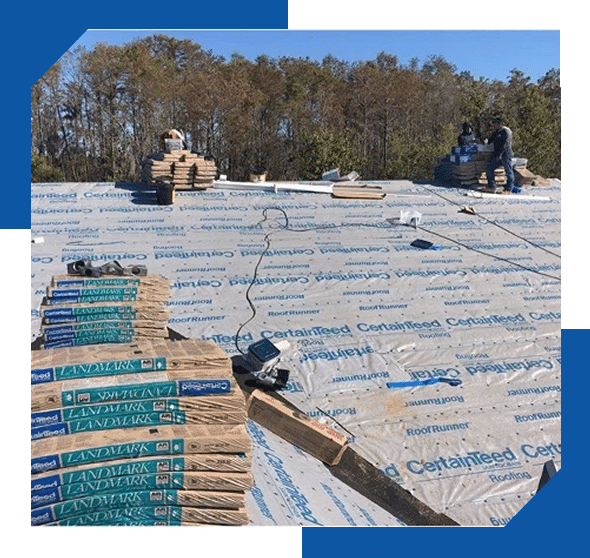 Roofers on a roof deck covered in CertainTeed underlayment, with bundles of Landmark shingles ready to install