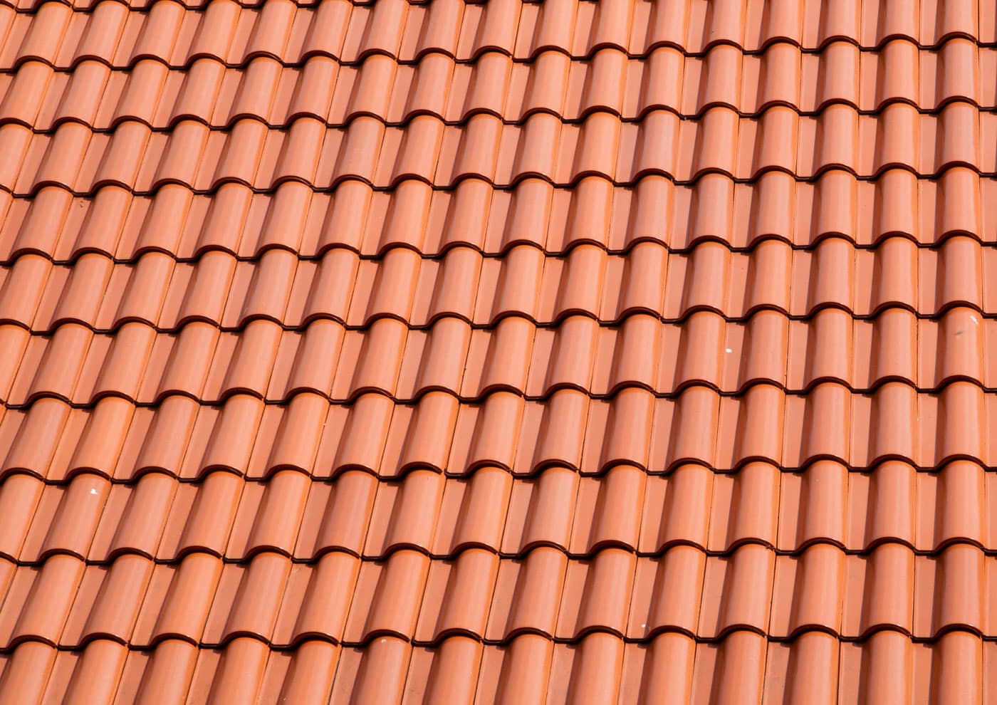 Close-up of orange clay barrel tile roofing