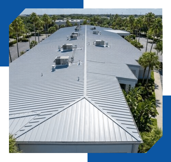 Standing-seam metal roof with rooftop AC units on a long commercial building among palm trees