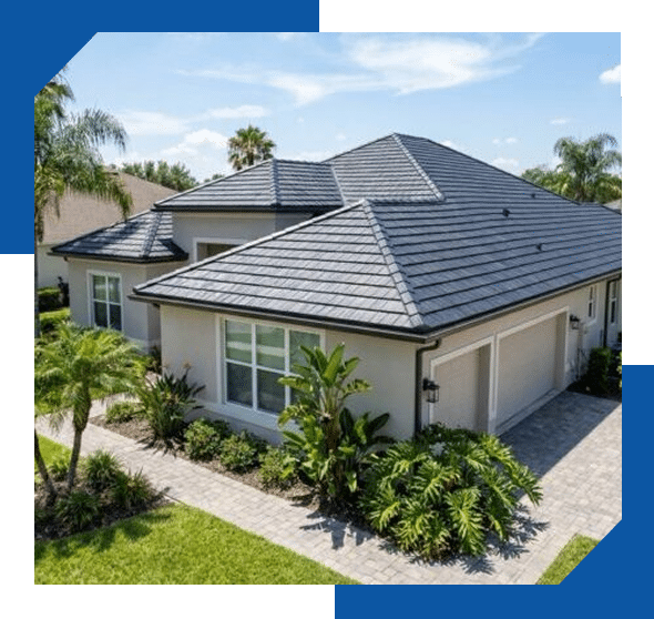 Gray hip roof on a single-story stucco home with a paver driveway and tropical landscaping