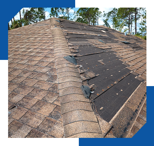 Storm-damaged shingle roof with large sections of shingles blown off, exposing the underlayment