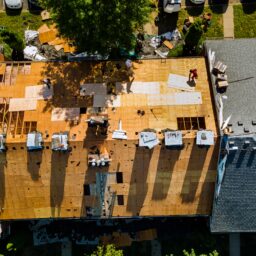 a worker replace shingles on the roof of a home re 2022 11 12 10 32 17 utc