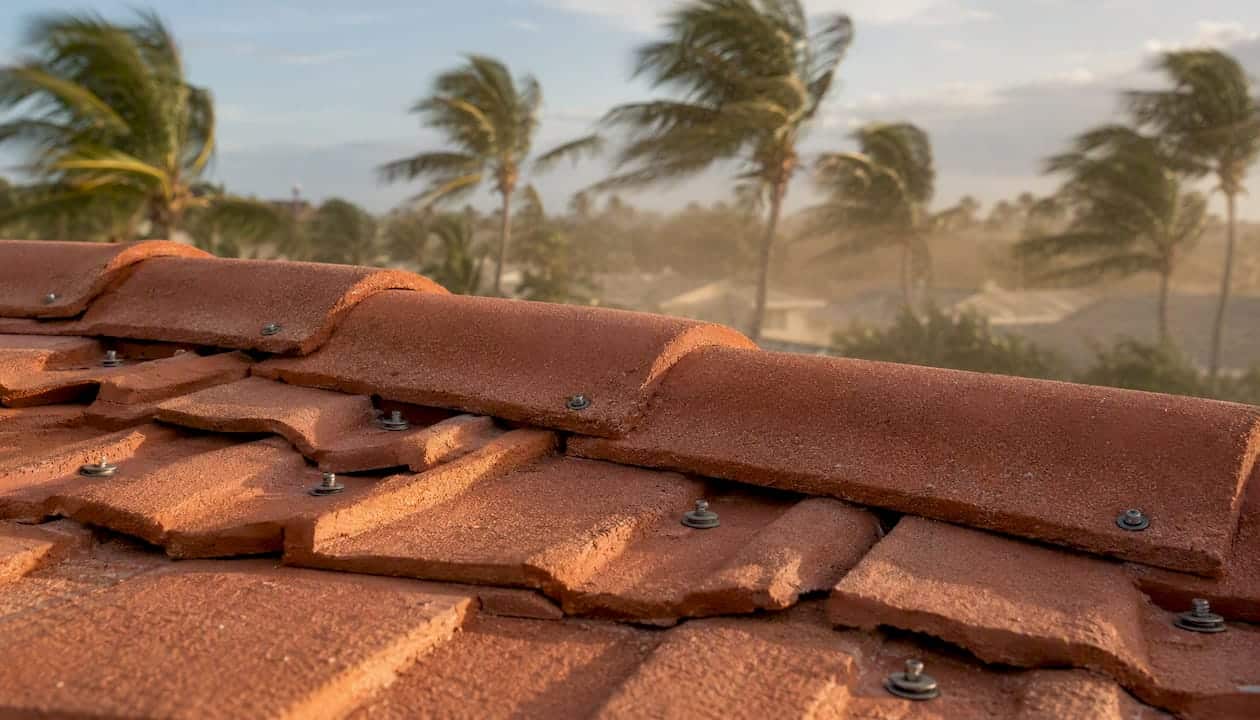 Clay tile secured with corrosion-resistant screws