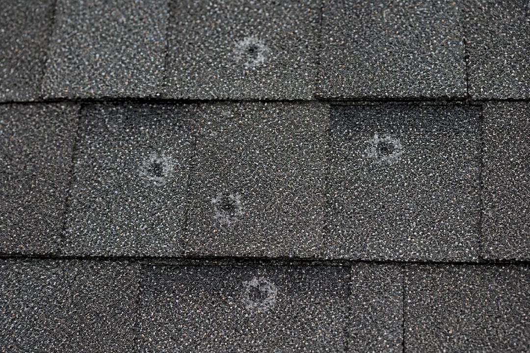Hail impact marks on asphalt shingles