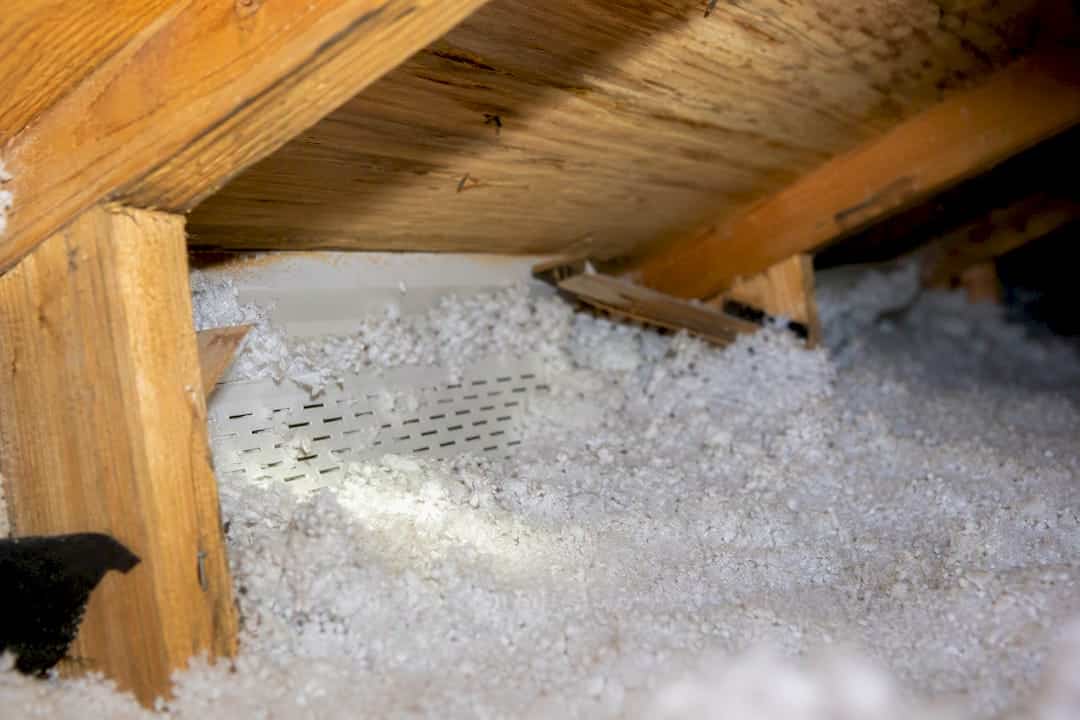 Insulation blocking an attic soffit intake